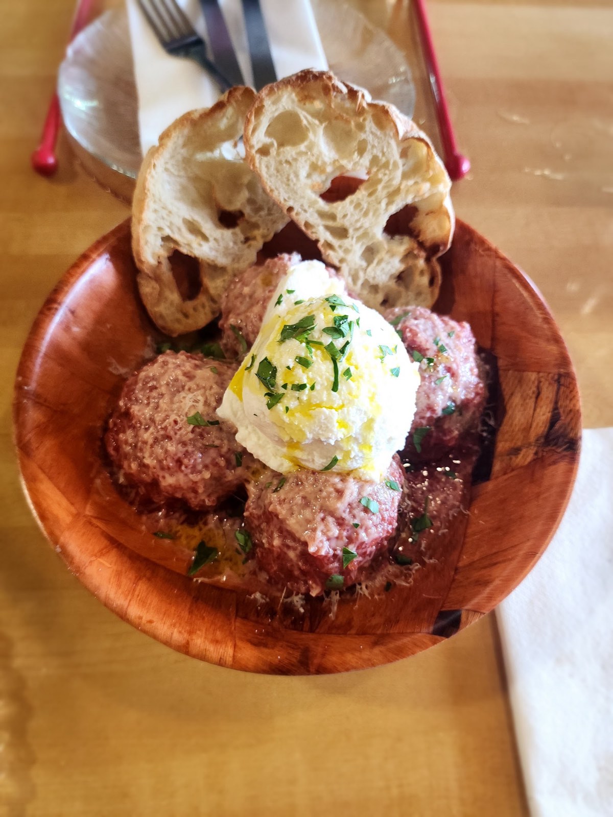 Meatball Supreme with whipped ricotta in red sauce